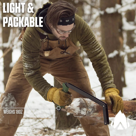 Person using 21 inch folding saw with all purpose blade for camping gear and outdoor adventures in snowy forest.