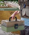 Person holding Three Layer Tackle Box With 475 Piece Lure Kit Included Crankbaits Weights Hooks And Accessories by a lake