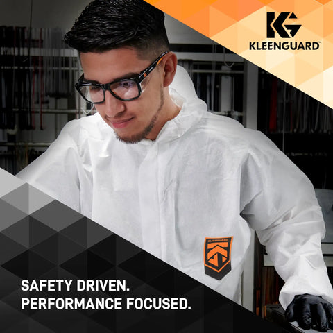 Man wearing Unisex Maverick Safety Glasses with Anti Fog Coating and Smoke Lenses, black frame, polycarbonate lenses, in lab.