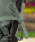 EarthFiber 4 Pack Outdoor Patio Dining Chair Cushions 20x44 Rain Proof Seat Pads close-up of tie detail in sage green texture