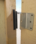 AM3 RM100C Magnet Catch Industrial Type with mounting holes, black finish installed on wooden door for heavy-duty enclosures