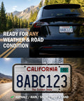 Heavy Duty Silicone License Plate Frame Set In Matte Black Fits Every US Ride Rust Proof And Storm Ready Two Pack showing license plate on car.