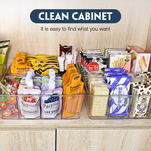 Heavy Duty Clear Plastic Pantry Storage Totes With Removable Dividers 2 Pack Kitchen Cabinet Organizers For Dry Goods Snacks Spices Medicine Fridge Shelf Caddies Keeping Your Counter Super Tidy And Stress Free filled with colorful snacks in a clean cabinet.