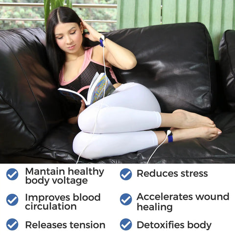 Person using EMF Shield Grounding Kit with 2 Cords and 2 Wrist Straps for Home Or Office, lying on couch with book