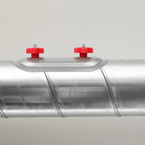 Side view of a 6-inch round duct access door on a silver metal duct with two red tightening knobs