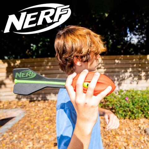 Person holding Vortex Aero Howler Foam Football With Mega Distance Passes Flight Tail For Long Throws Whistling Roar In Flight