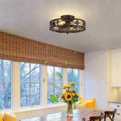 Rustic Black Caged Flush Mount Ceiling Fan With Lights And Remote in a farmhouse kitchen with wood table and flowers