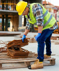 Construction worker using Rugged Steel Toe Covers For Boots And Shoes, Tough-As-Nails Toe Caps for safety on site