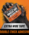 Heavy Duty Black Duct Tape, Extra Wide 2.88 Inch By 25 Yard Roll, Weather Resistant For Indoor Or Outdoor Use, held by gorilla hand