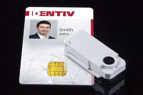 SCR3500 USB Smart Card Reader For ID1 ISO 8716 Cards next to an ID card on a black surface