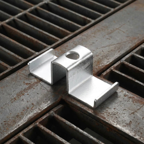 Heavy Duty Galvanized Saddle Clips For Steel Grating on industrial walkway, carbon steel, tough, easy installation.