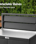Black outdoor potting bench with storage cabinet and stainless steel work surface, showing detachable shelves in garden setting.