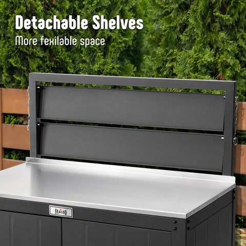 Black outdoor potting bench with storage cabinet and stainless steel work surface, showing detachable shelves in garden setting.