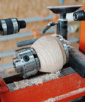 BMWOOD woodturning live tailstock chuck adapter on lathe turning a light wood blank