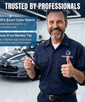 Mechanic holding Exact Color Match Car Paint Touch Up Pen For Cars, SUVs And Trucks in garage with parked vehicle.
