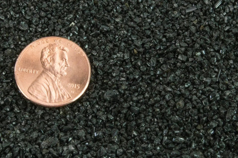 Medium Grit 12 To 40 Mesh Abrasive Blast Media with a penny for scale, used for Sandblast Cabinets, 10 lb bag