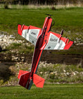 Eratix 3D Flat Foamy 860mm Ready To Fly RC Airplane with brushless motor flying outdoors showcasing aerobatic capability.
