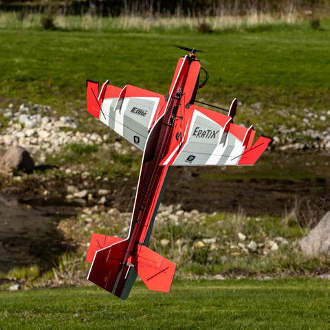 Eratix 3D Flat Foamy 860mm Ready To Fly RC Airplane with brushless motor flying outdoors showcasing aerobatic capability.