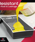 Liquid paint pouring into a 9-inch disposable liner in a roller tray, featuring heavy duty plastic with textured ridges for easy cleanup
