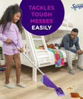 Girl using WetJet Hardwood And Floor Spray Mop Cleaner Starter Kit on wooden floor near bed, father watching.