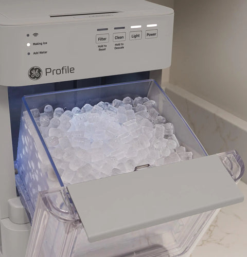 Legit Nugget Ice Maker showing soft chewable ice in the 2-pound storage bin, countertop design, stone grey finish.