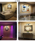 Rechargeable Picture Lights For Wall Art Set Of 2 With 5000mAh Battery Remote Control And 3 Color Temperature Dimmable LEDs lighting bedroom, dining room, dartboard, and artwork.