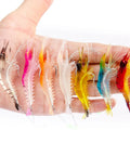 14 Piece Glow In The Dark Shrimp Lures Set With Bait Box 7 Color Premium Soft Shrimp Tackle displayed on a hand.