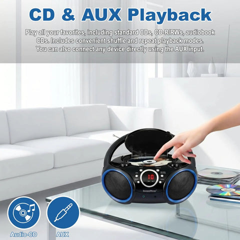 Hand operating Portable CD Player Boombox With Top-Loading Disc, 20-Track Programmable Memory, AM/FM Stereo, in modern living room.
