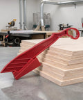 Rock Solid Table Saw Push Stick With Riving Knife Splitter 16.5 Inches Long on plywood in workshop for safe cutting.