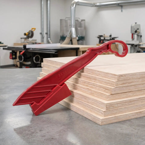 Rock Solid Table Saw Push Stick With Riving Knife Splitter 16.5 Inches Long on plywood in workshop for safe cutting.