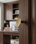 Vintage Leaf Cabinet Knobs Set, 4 Pack, Zinc Alloy Drawer Pulls With Single Hole Mount, Gold Finish on wooden cabinet