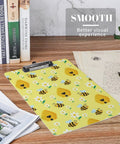 Honey Bee Print Sturdy Acrylic Clipboard For A4 Papers, Clear Desk Organizer With Smooth Writing Surface, Real Deal Heavy Duty See Through Clipboard For School, Office, Or Home, Fits US Letter And A4. Yellow bee print acrylic clipboard with metal clip on desk.