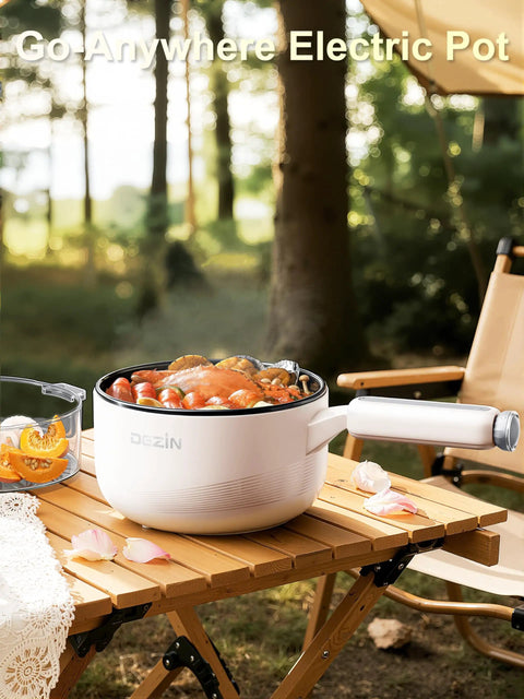 Electric Hot Pot With Steamer 2L Nonstick Saute Pan on wooden table outdoors