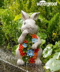 Solar Garden Bunny Statue With Succulent And Seven LED Lights Lawn Decor For Patio Balcony And Yard in rain with greenery