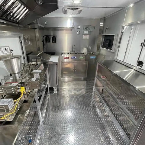 Inside view of Custom Rollout Food Trailer Kitchen Unit Featuring Heavy Duty Refrigerator Commercial Sink And Stainless Steel Juicer Station.