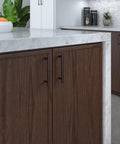 Brushed Oil Rubbed Bronze Cabinet Handle Four And A Quarter Inch Center To Center Steel Drawer Pull installed on dark wood cabinet in kitchen