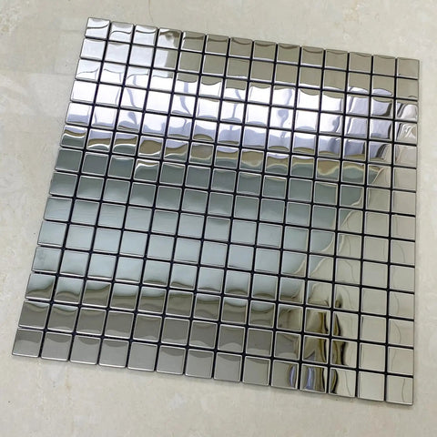 10 Sheet Stainless Steel Peel And Stick Backsplash Tiles For Kitchen 3D Plaid Silver Accent Wall Panels Waterproof Heat Resistant Dope Modern Upgrade For Easy DIY Install, close-up view of a single 11.8 x 11.8 inch tile sheet with shiny silver squares.