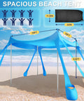 Pop Up Beach Canopy Sun Shelter With UPF Fifty And Ten By Ten Foot Coverage, windproof frame, eight sandbags in sky blue on beach