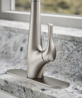 Top Shelf Pull Down Kitchen Sink Faucet With Smooth Glide Retractable Hose And Dual Function Sweep Sprayhead, close-up view on counter.