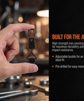 Hand holding a heavy-duty adjustable toggle clamp showcasing high-strength iron construction for secure locking.