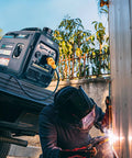 Dual Fuel Portable Generator With 4000W Peak And 3200 Running On Gas Or 3600 Peak And 2800 Running On Propane in use during welding.