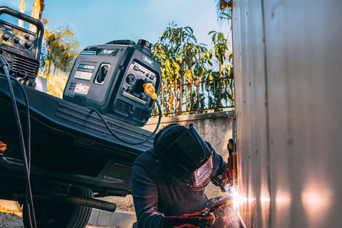 Dual Fuel Portable Generator With 4000W Peak And 3200 Running On Gas Or 3600 Peak And 2800 Running On Propane in use during welding.