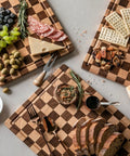 Real Deal Acacia Wood Checkered Cutting Board With Deep Juice Grooves And Solid Handles Large 17 Inch Butcher Block Serving Platter with meats and veggies