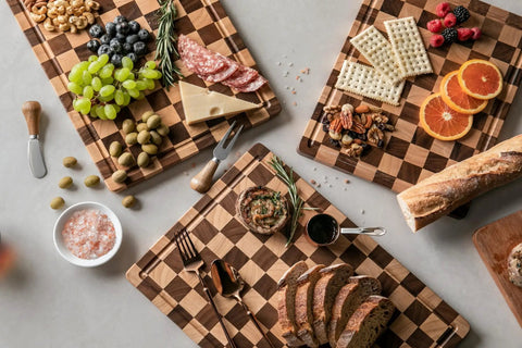 Real Deal Acacia Wood Checkered Cutting Board With Deep Juice Grooves And Solid Handles Large 17 Inch Butcher Block Serving Platter with meats and veggies