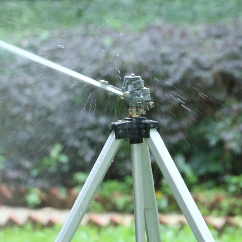 Heavy Duty Impact Sprinkler On Tripod Base With Extra Tall Pulsating Metal Sprinkler For Large Yards And Gardens Telescoping Legs Waters Up To 90 Ft Diameter Durable Tripod System in action.