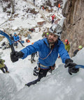 Climber using Raptor Ice Tool For Technical Ice Climbing And Mountaineering With Dope Modular Picks on icy route.