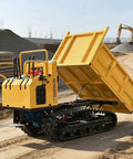 Heavy Duty Mini Crawler Dumper With Responsive Hydraulic Lift System Paired With Tough As Nails Track Carrier unloading on a jobsite.