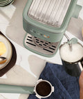 20 Bar Slim Espresso Maker With 1300 Watt Pump And 360 Degree Steam Wand For Silky Microfoam shown above countertop with milk frothing.