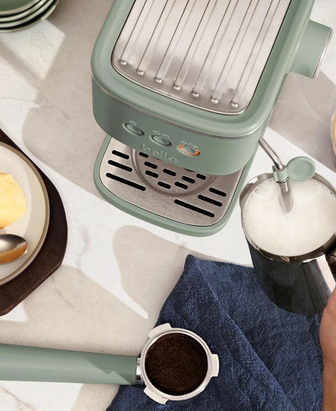 20 Bar Slim Espresso Maker With 1300 Watt Pump And 360 Degree Steam Wand For Silky Microfoam shown above countertop with milk frothing.