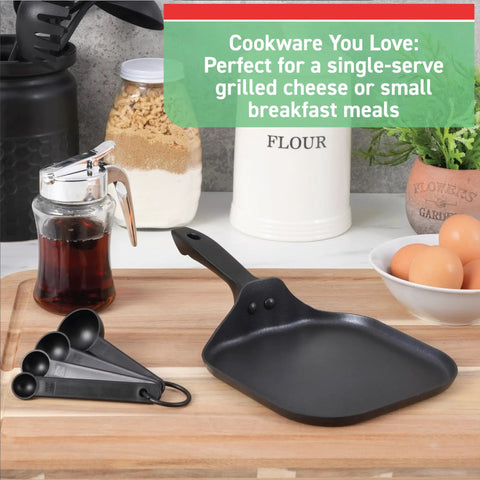 Specialty Nonstick Mini Griddle 6.5 Inch Pan on countertop with eggs and syrup, black cookware, even heat base visible